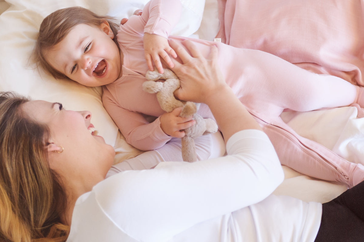 Woman laughing with baby