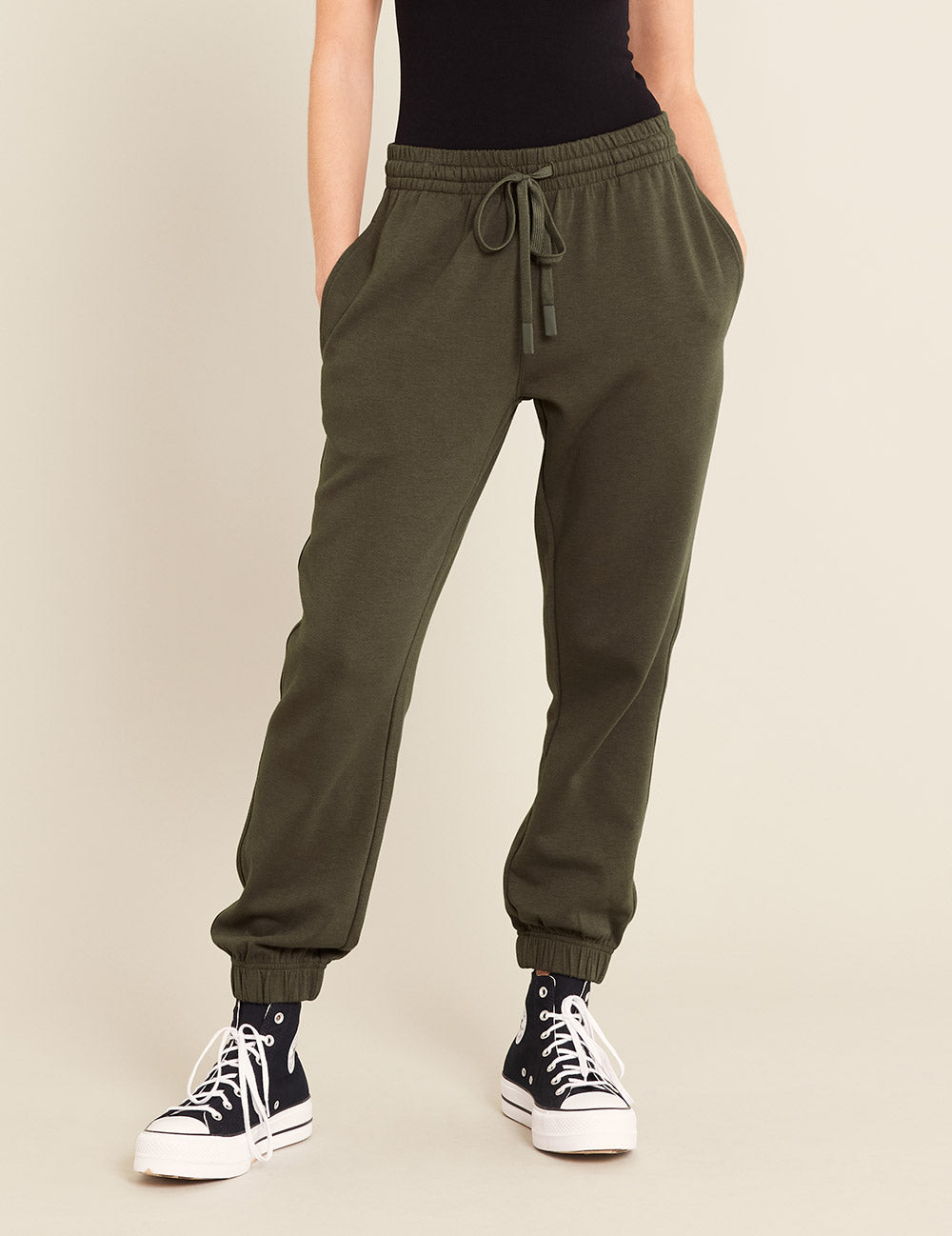 Gender-Neutral-Cuffed-Sweat-Pants-Dark-Olive-Female-Front.jpg